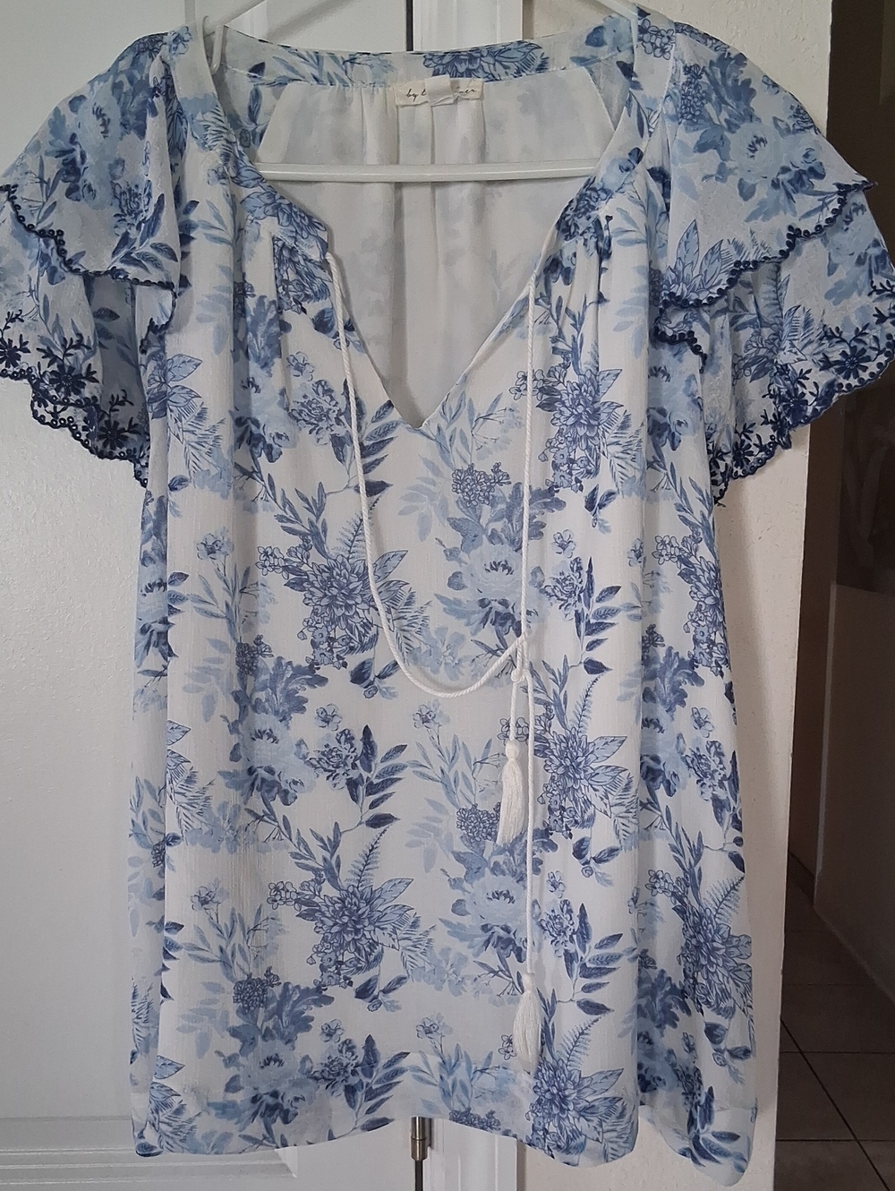 B:  Blue Floral Tie-Neck Women's Blouse by (unknown)